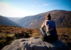 A woman looking at the view in the Wicklow Mountains