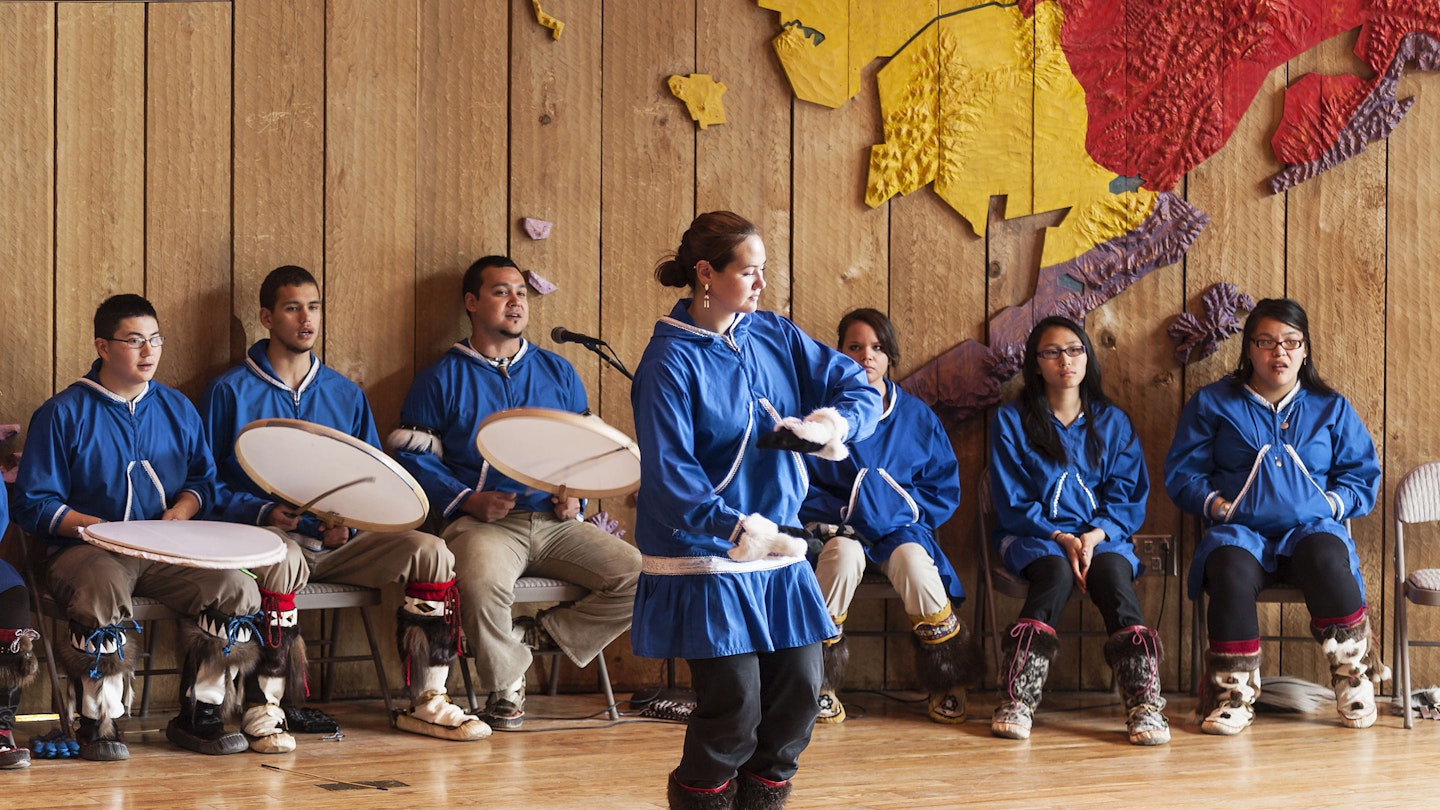 ANCHORAGE, ALASKA, UNITED STATES - 2009/06/18: Native Alaskan youth demonstrates the traditional dance of her culture at the Native Alaskan Heritage Center. (Photo by John Greim/LightRocket via Getty Images)