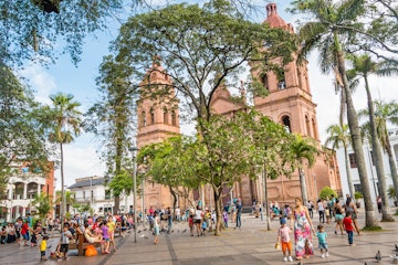 People relax in front of the Cathedral Basilica of St Lawrence in Santa Cruz, Bolivia