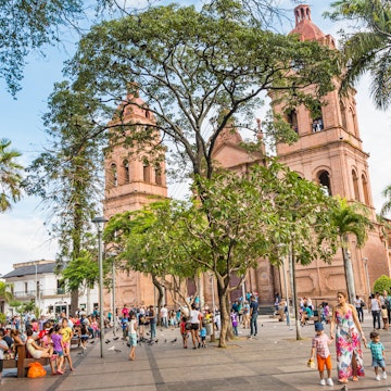 People relax in front of the Cathedral Basilica of St Lawrence in Santa Cruz, Bolivia