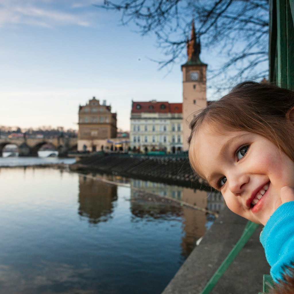Toddler girl at Vltava river bank, Prague