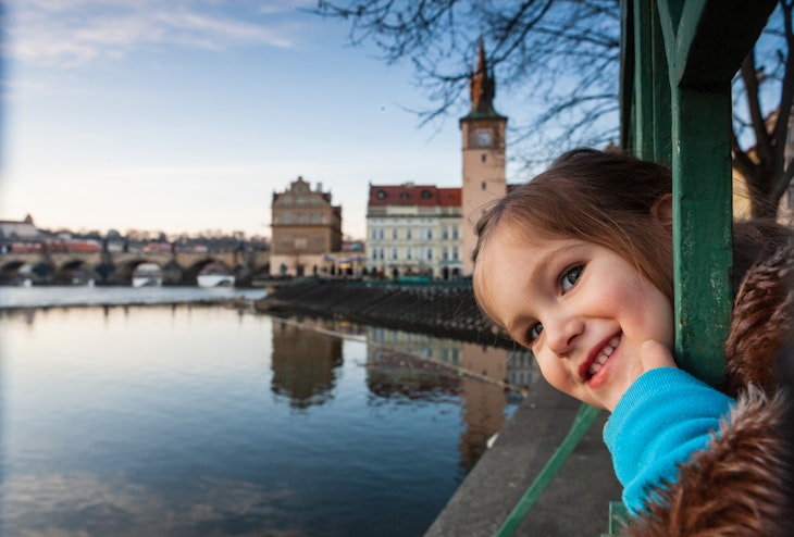 Toddler girl at Vltava river bank, Prague