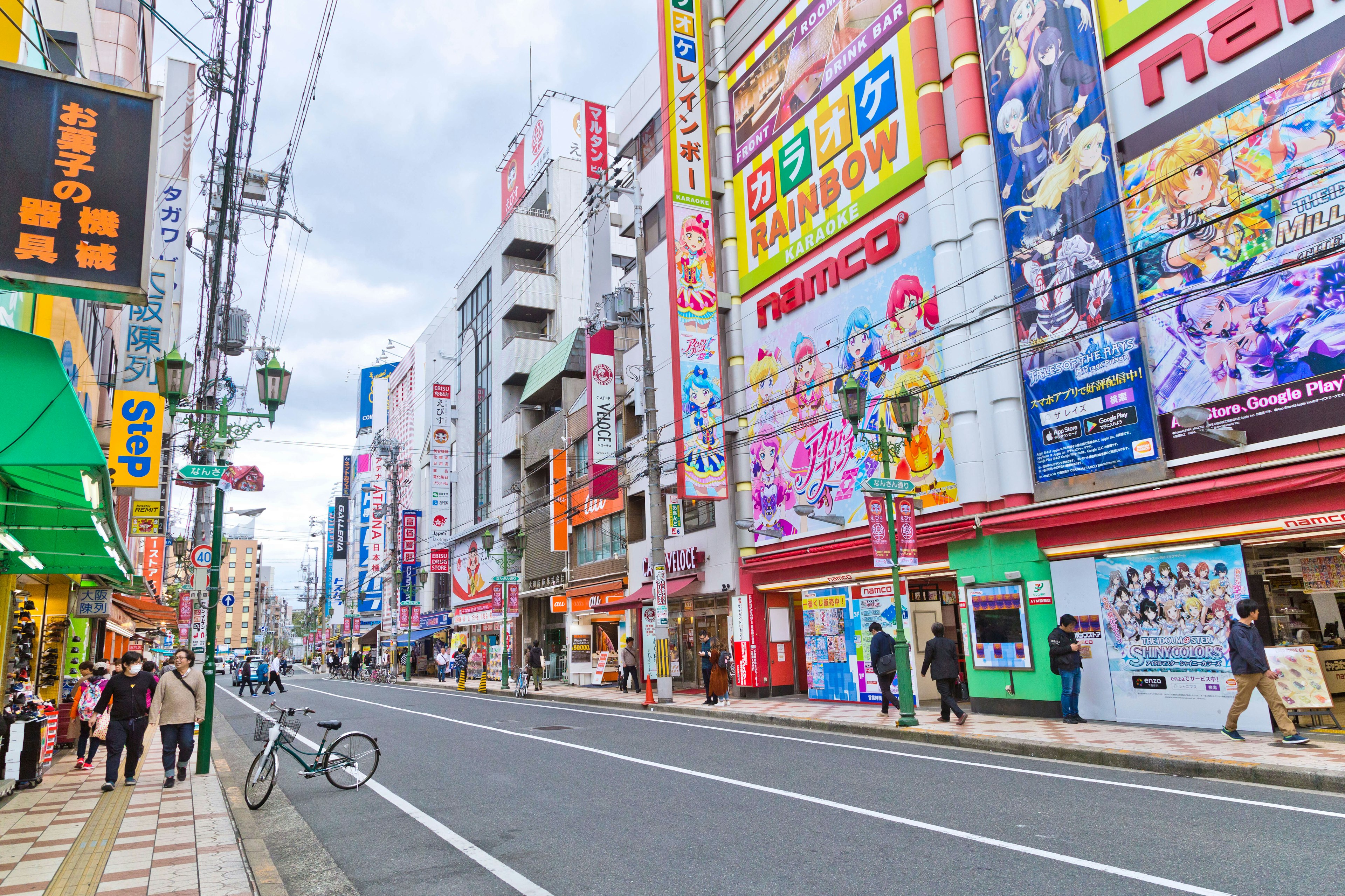 People walking in front of the colorful cartoon shop in Nipponbashi Osaka, the famous place for Japanese pop-culture anime and gaming fans