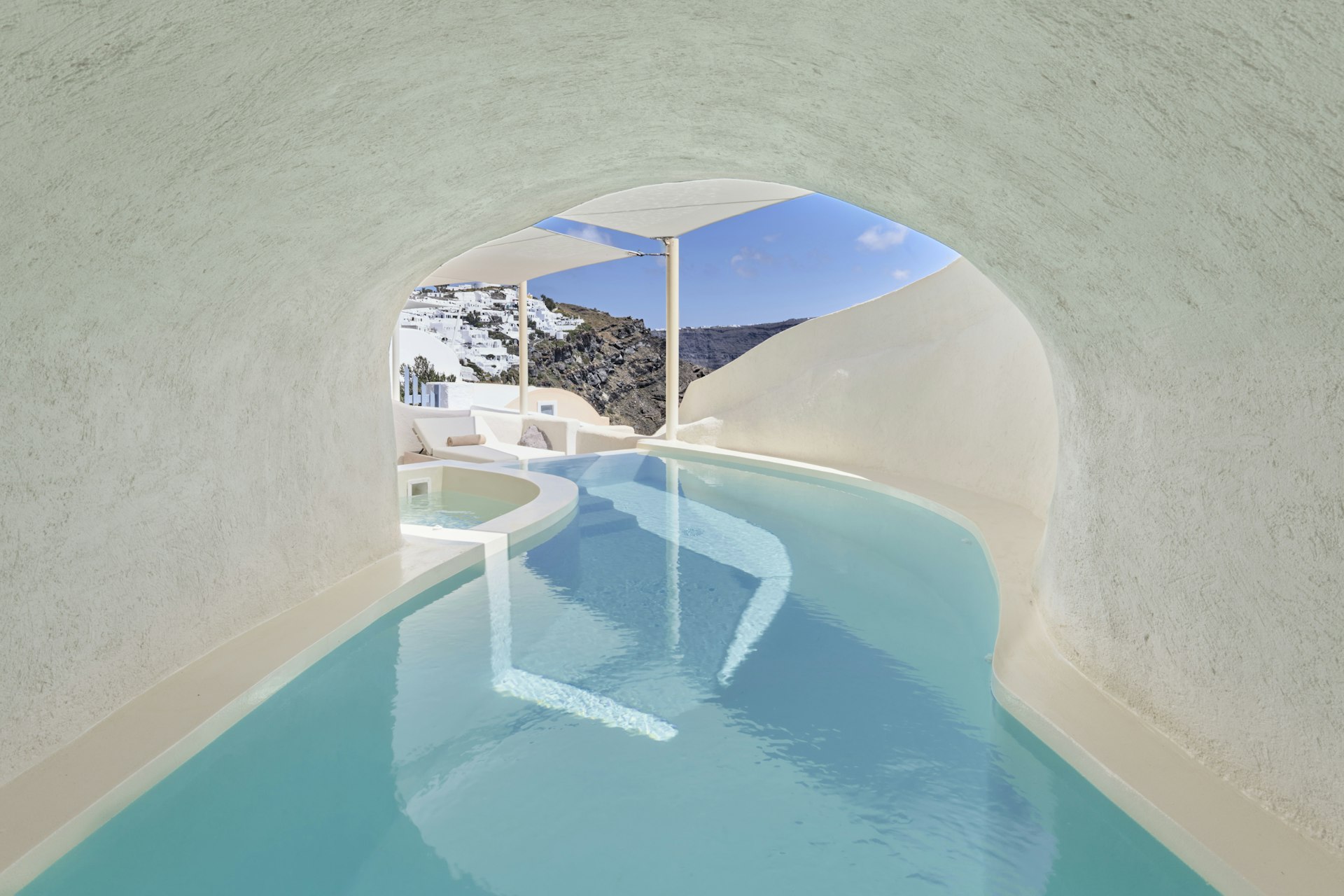 A private pool that snakes through a covered passageway