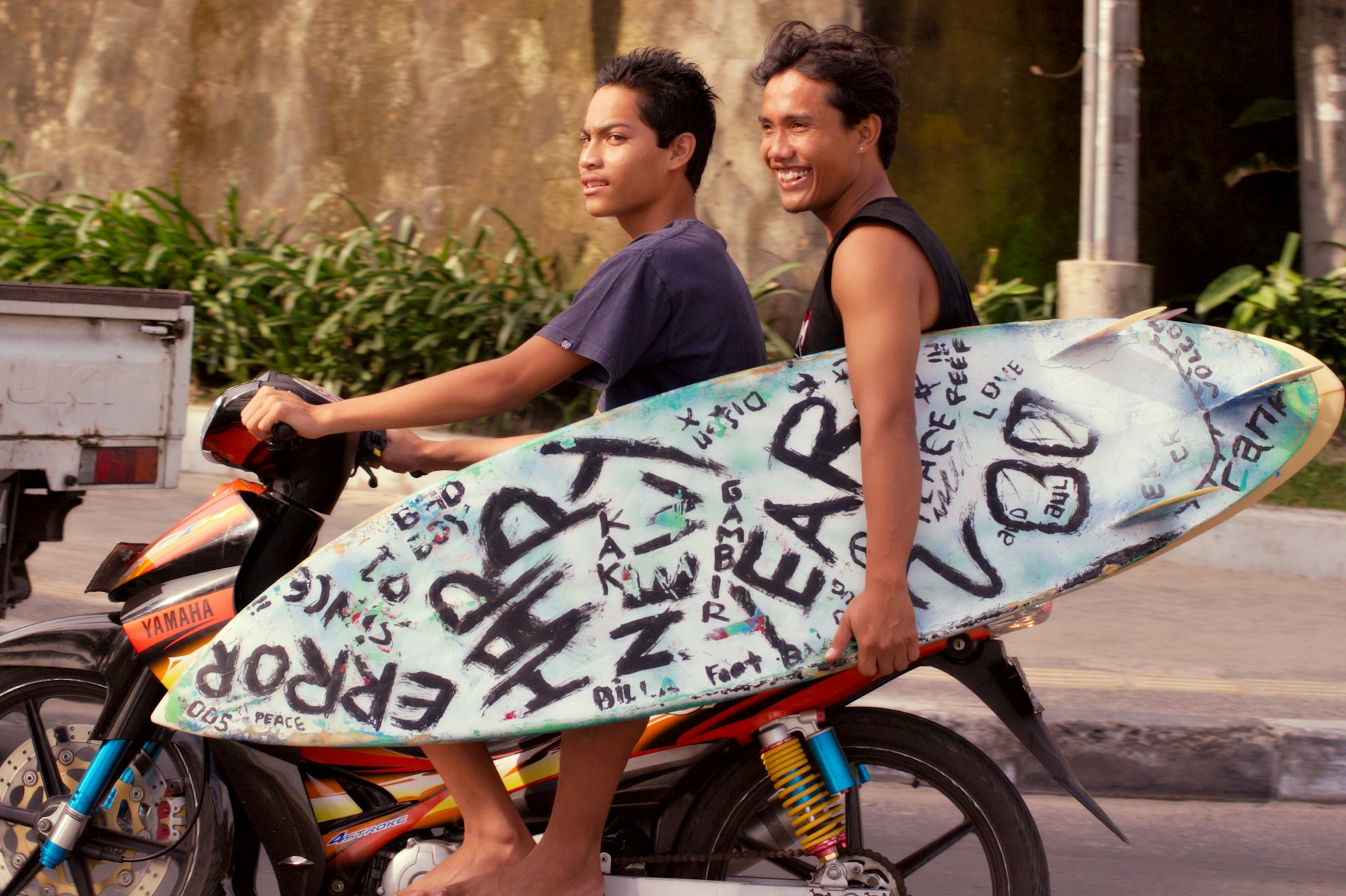 Two people riding a bike in Bali 