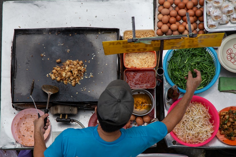 Street Food Vendor Frying Carrot Cake. Fried carrot cake is popular local food in Malaysia among Chinese in Kota Kinabalu City, Sabah, Malaysia; Shutterstock ID 1399294724; your: Claire Naylor; gl: 65050; netsuite: Onlin editorial; full: Malaysia places to go