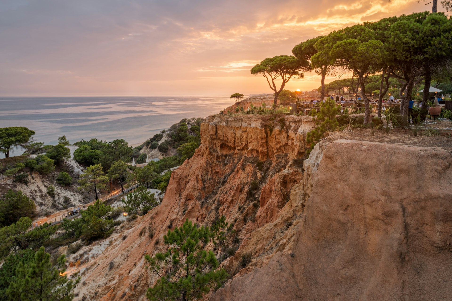 Dinner guests at the Pine Cliffs Resort in Mirador sits amongst the trees at the top of the ochre cliffs of Portugal's Algarve region