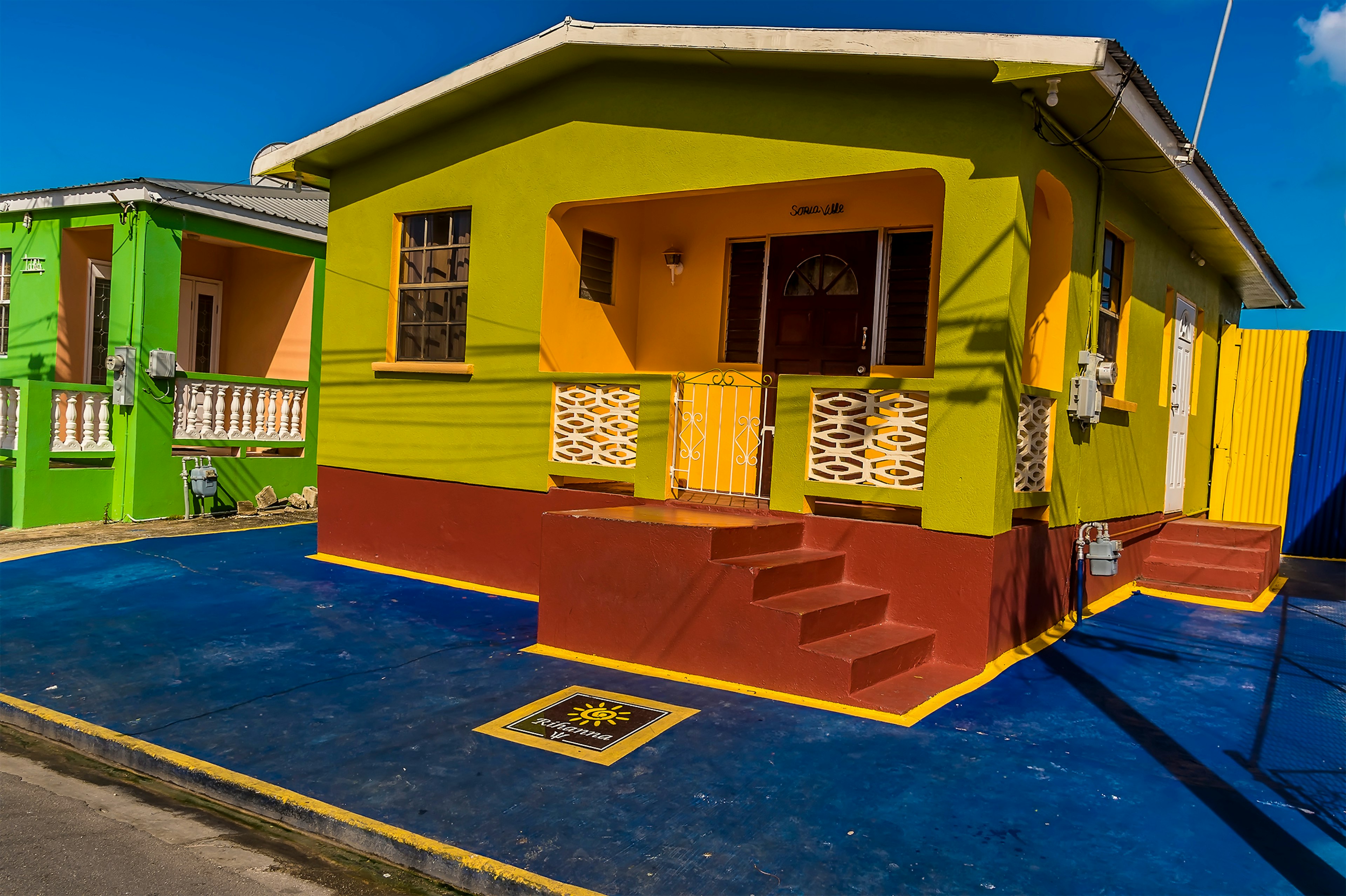 Exterior shot of the multi-colored house of international pop star Rihanna's childhood home in Barbados.