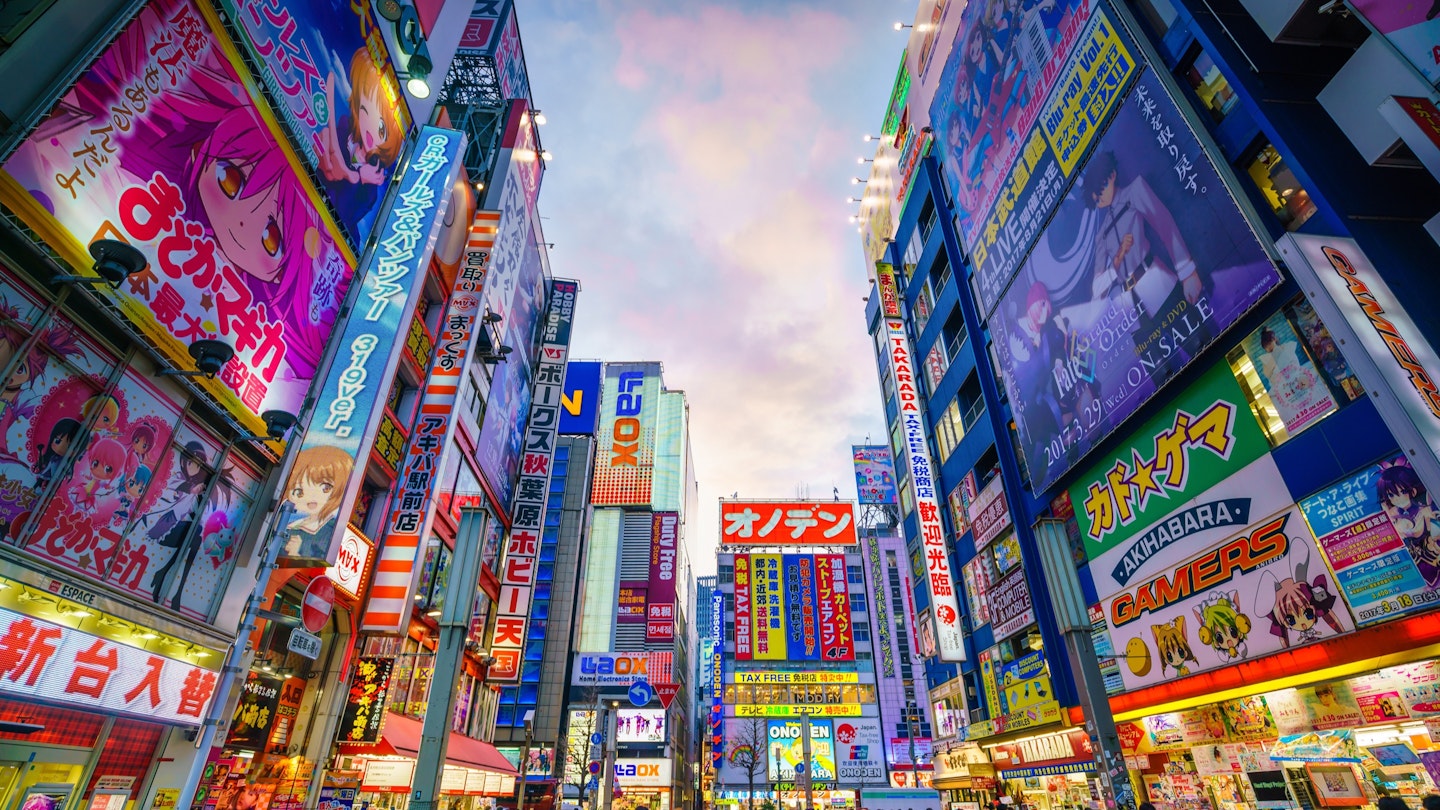 Tokyo, Japan - MARCH 28, 2017: Neon signs and billboard advertisements in Akihabara electronics hub at twilight on March 28, 2017; Shutterstock ID 626245934; your: Ben N Buckner; gl: 65050; netsuite: Online Editorial; full: Tokyo Walking (sponsored)