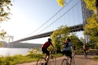 Cyclists in Brooklyn pedaling toward the George Washington Bridge
