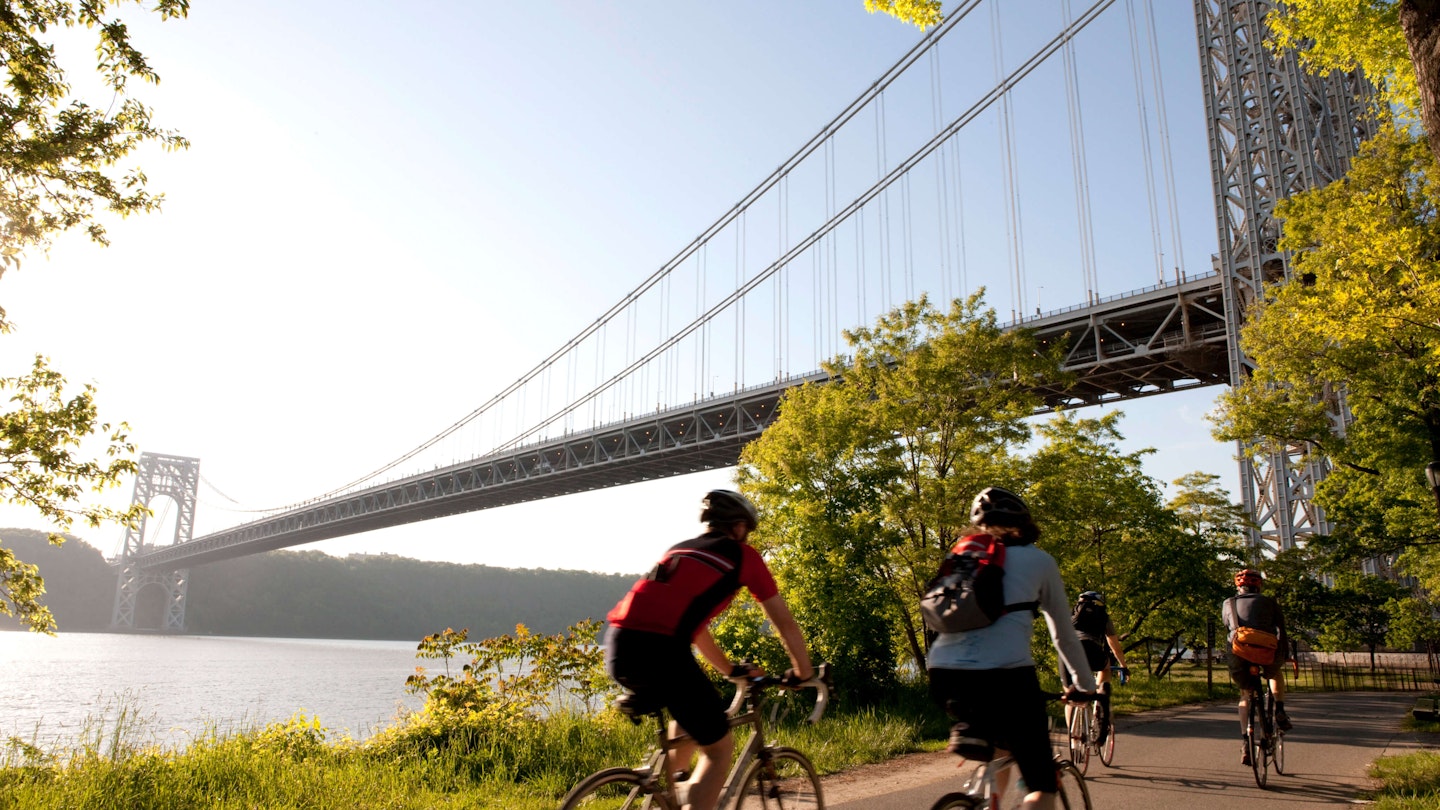 Cyclists in Brooklyn pedaling toward the George Washington Bridge