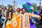 NEW ORLEANS, LOUISIANA - MARCH 05: (L-R) Lawrence Boudreaux, Marwan Pleasant, Jwan Boudreaux,  and Nigel Pleasant of the Golden Eagles Mardi Gras Indians face off with another tribe on March 5, 2019 in New Orleans, Louisiana. (Photo by Erika Goldring/Getty Images)