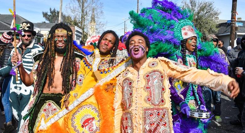 NEW ORLEANS, LOUISIANA - MARCH 05: (L-R) Lawrence Boudreaux, Marwan Pleasant, Jwan Boudreaux, and Nigel Pleasant of the Golden Eagles Mardi Gras Indians face off with another tribe on March 5, 2019 in New Orleans, Louisiana. (Photo by Erika Goldring/Getty Images)