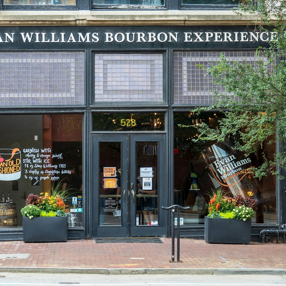 Louisville, KY - Sept. 11, 2021: Evan Williams Bourbon Experience on Whiskey Row is part of the Urban Bourbon Trail and features the world's largest rocks glass in their front window.; Shutterstock ID 2039952233; your: Bridget Brown; gl: 65050; netsuite: Online Editorial; full: POI Image Update