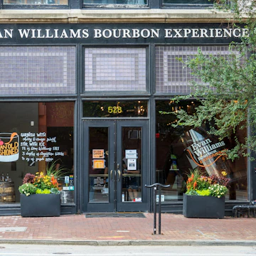Louisville, KY - Sept. 11, 2021: Evan Williams Bourbon Experience on Whiskey Row is part of the Urban Bourbon Trail and features the world's largest rocks glass in their front window.; Shutterstock ID 2039952233; your: Bridget Brown; gl: 65050; netsuite: Online Editorial; full: POI Image Update