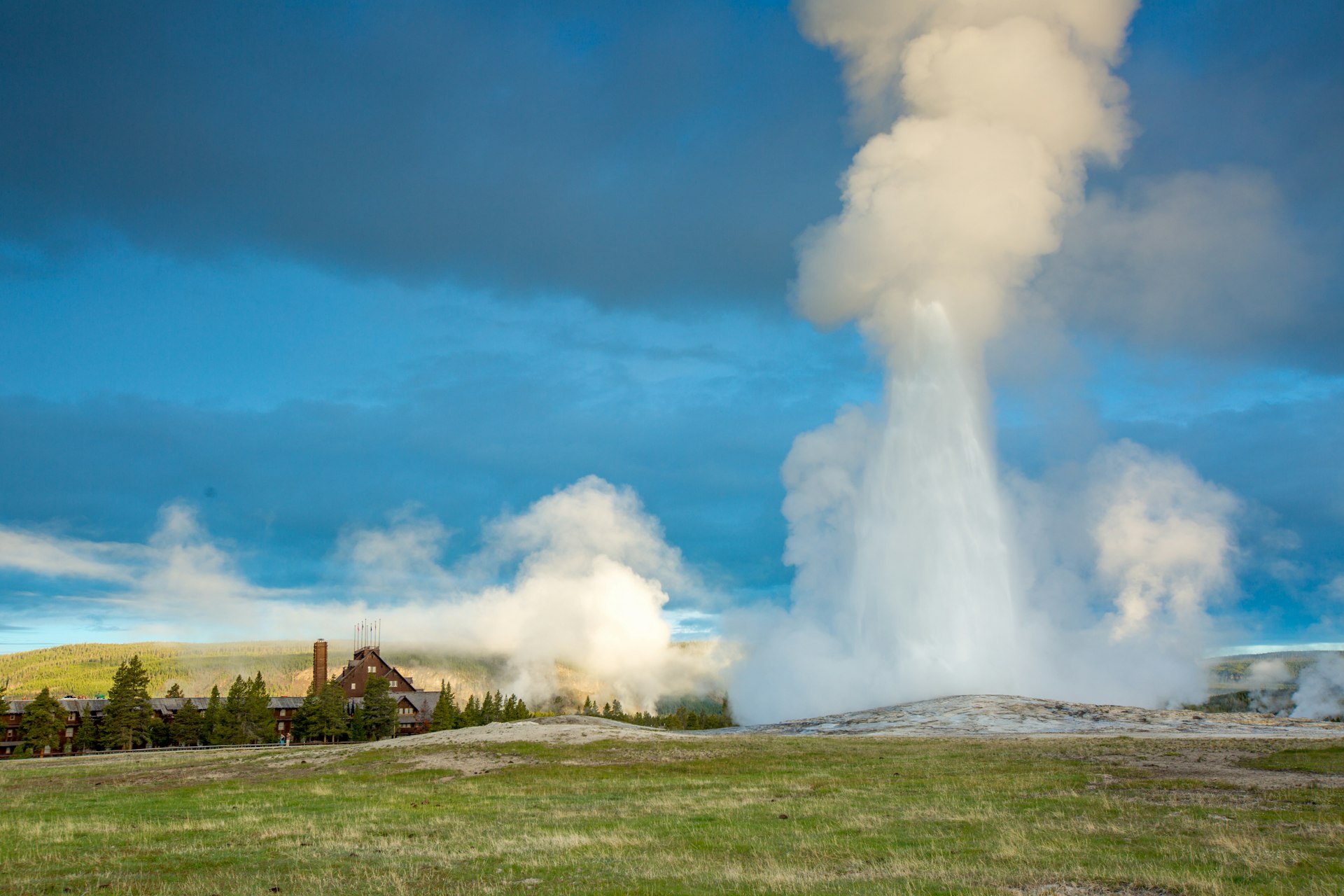Yellowstone National Park Old Faithful in the foreground with the Inn in the background