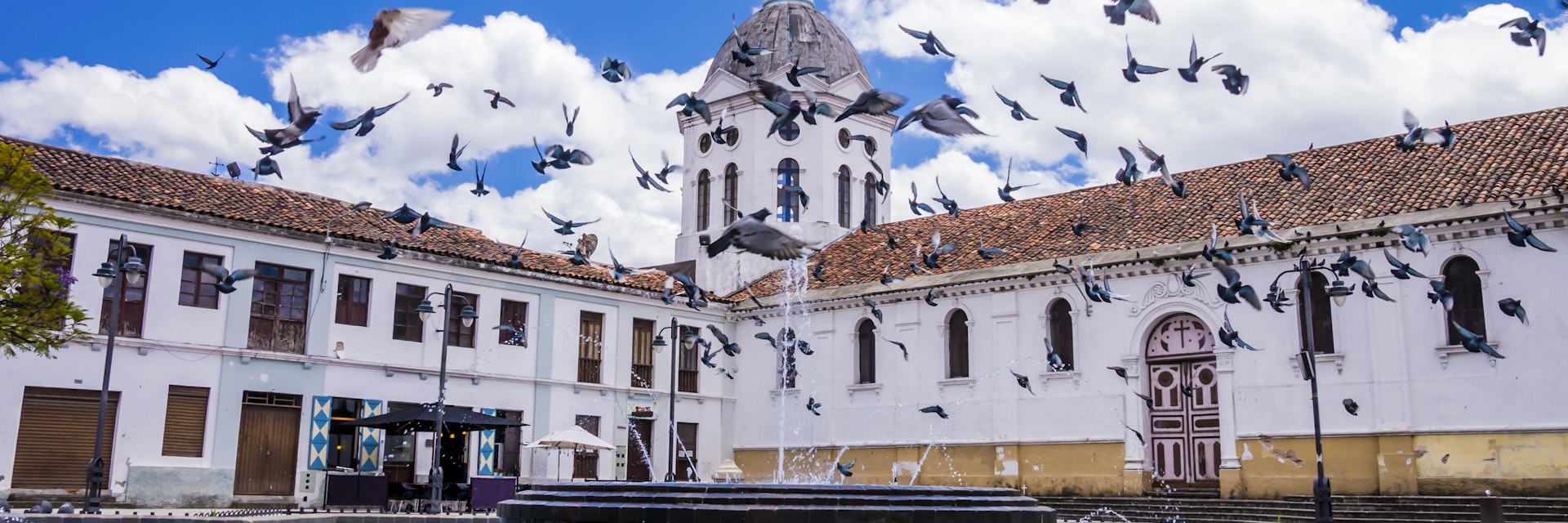 Ecuador, Cuenca city center, scenic view of San Sebastian church with fountain in foreground