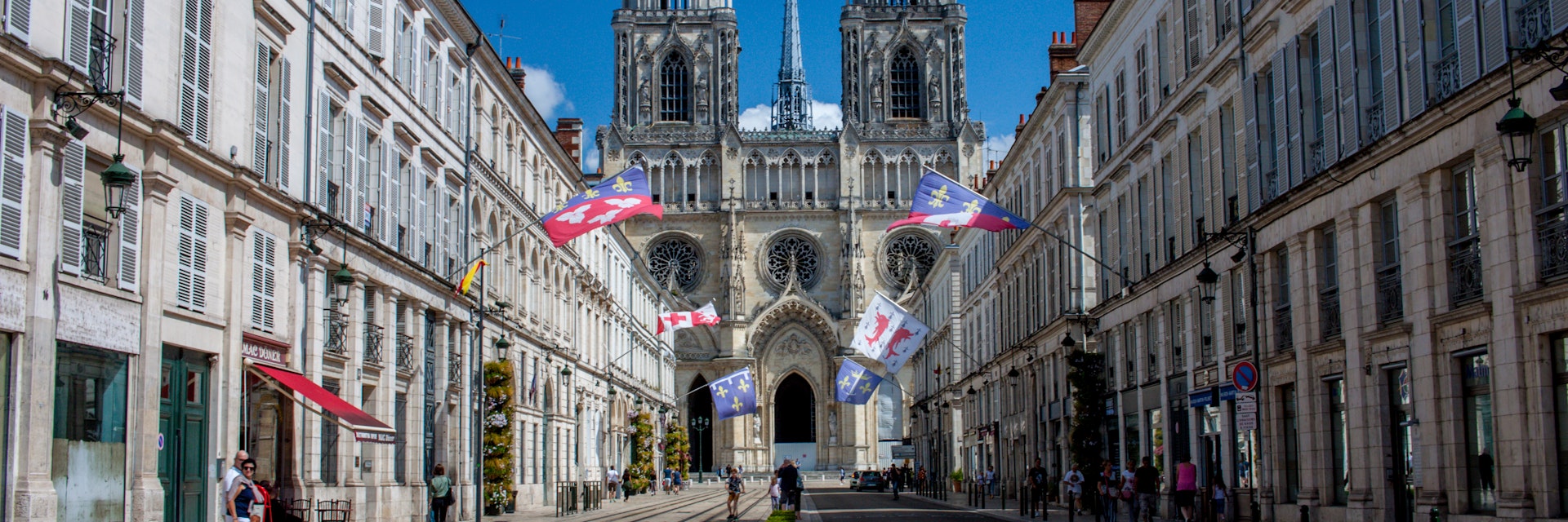 Cathédrale Sainte-Croix rises up above Rue Jeanne d'Arc in Orléans, France.