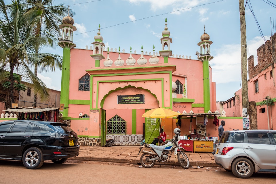Jinja / Uganda - September 15, 2016: entrance arch to colorful pastel colored mosque