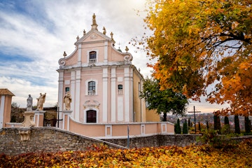 Beautiful Catholic church on an autumn day in Kamianets-Podilskyi.