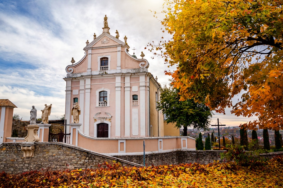 Beautiful Catholic church on an autumn day in Kamianets-Podilskyi.