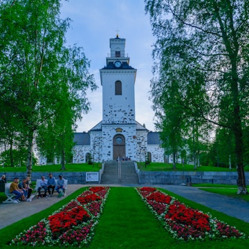 Kuopio: The Snellmanin Puisto park and the Lutheran Cathedral, with locals and visitors, in Kuopio, Finland