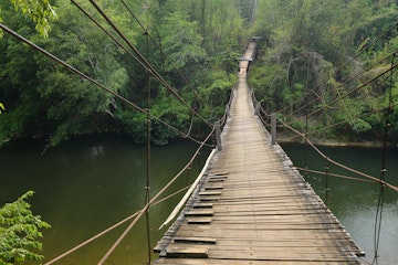 Suspension bridge over Mae Chan river at Mae Chan Tha Village, Tak