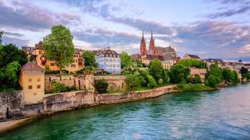 Panoramic view of the Old Town of Basel with red stone Munster cathedral and the Rhine river, Switzerland