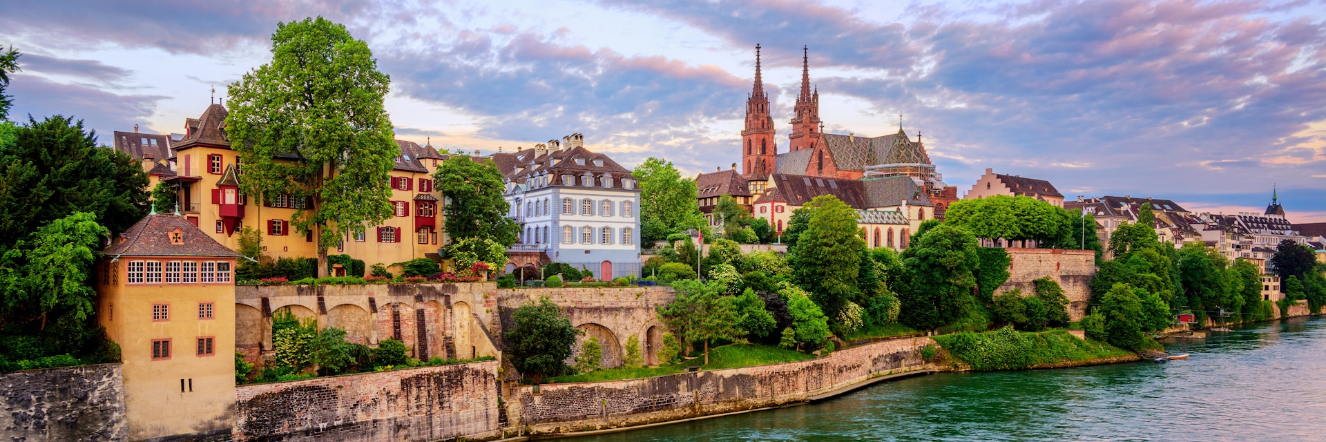 Panoramic view of the Old Town of Basel with red stone Munster cathedral and the Rhine river, Switzerland