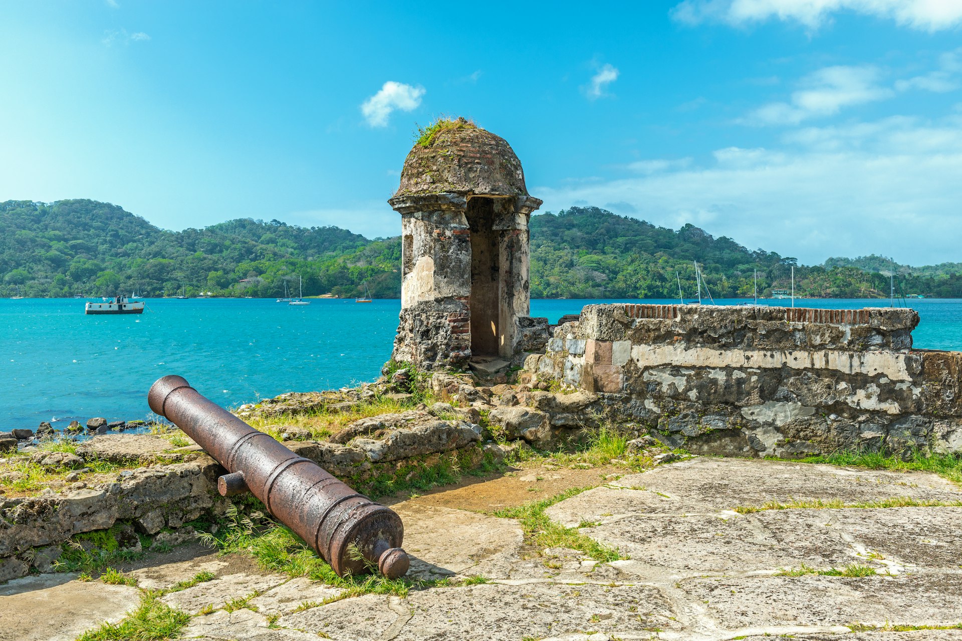 Old Spanish cannon at the fortress ruin of Santiago with a view over the Caribbean Sea in Portobelo near Colon, Panama, Central America. 