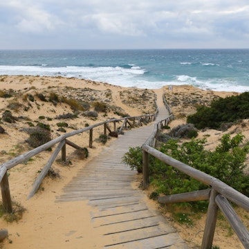 Footpath at the rough coastline of Cape Trafalgar, Province of Cádiz, Spain