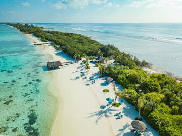 Aerial view made with drone of Canareef Resort Maldives, Addu City, Herathera island, Addu atoll (former Seenu Atoll), Maldives. Luxury travel holidays background. Property released.