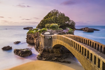 Bridge to the Rocher du Basta rock on the beach in Biarritz, France.