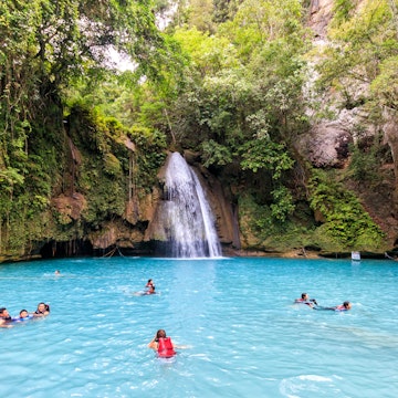 Cebu, Philippines - June 18, 2018: People swimming in Kawasan Falls in Cebu
