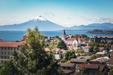 Aerial of Puerto Varas with Sacred Heart Church and Osorno Volcano in the background.