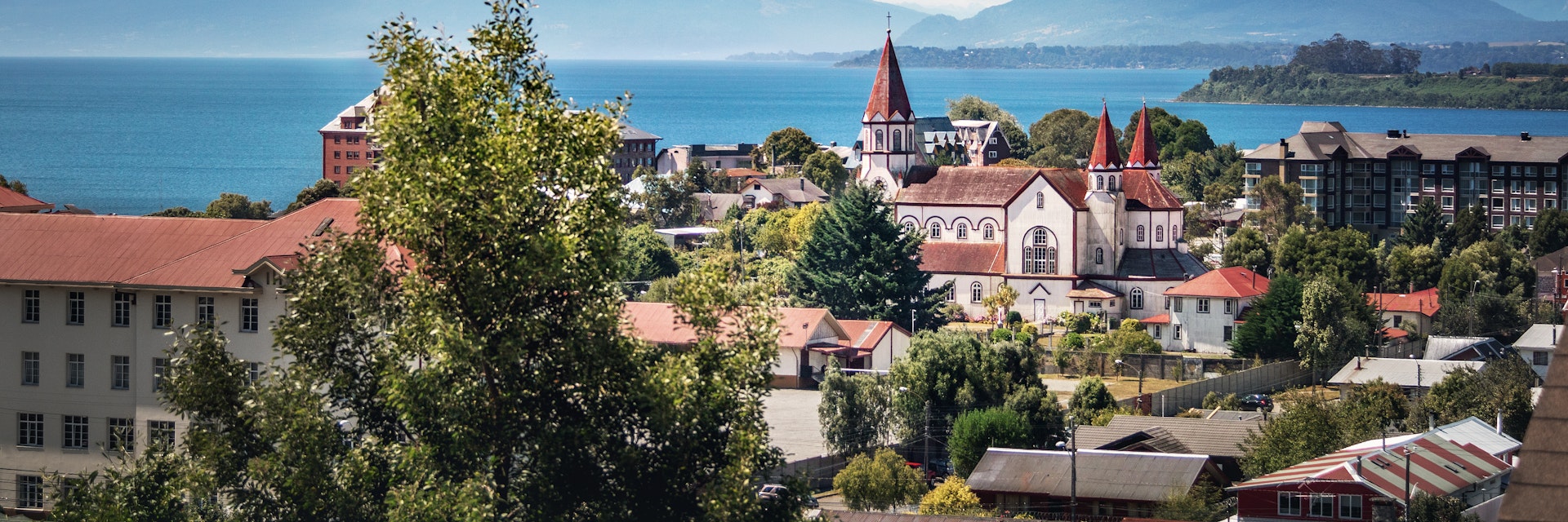 Aerial of Puerto Varas with Sacred Heart Church and Osorno Volcano in the background.