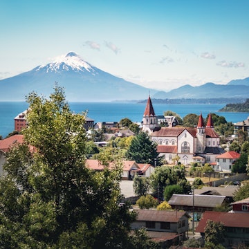Aerial of Puerto Varas with Sacred Heart Church and Osorno Volcano in the background.