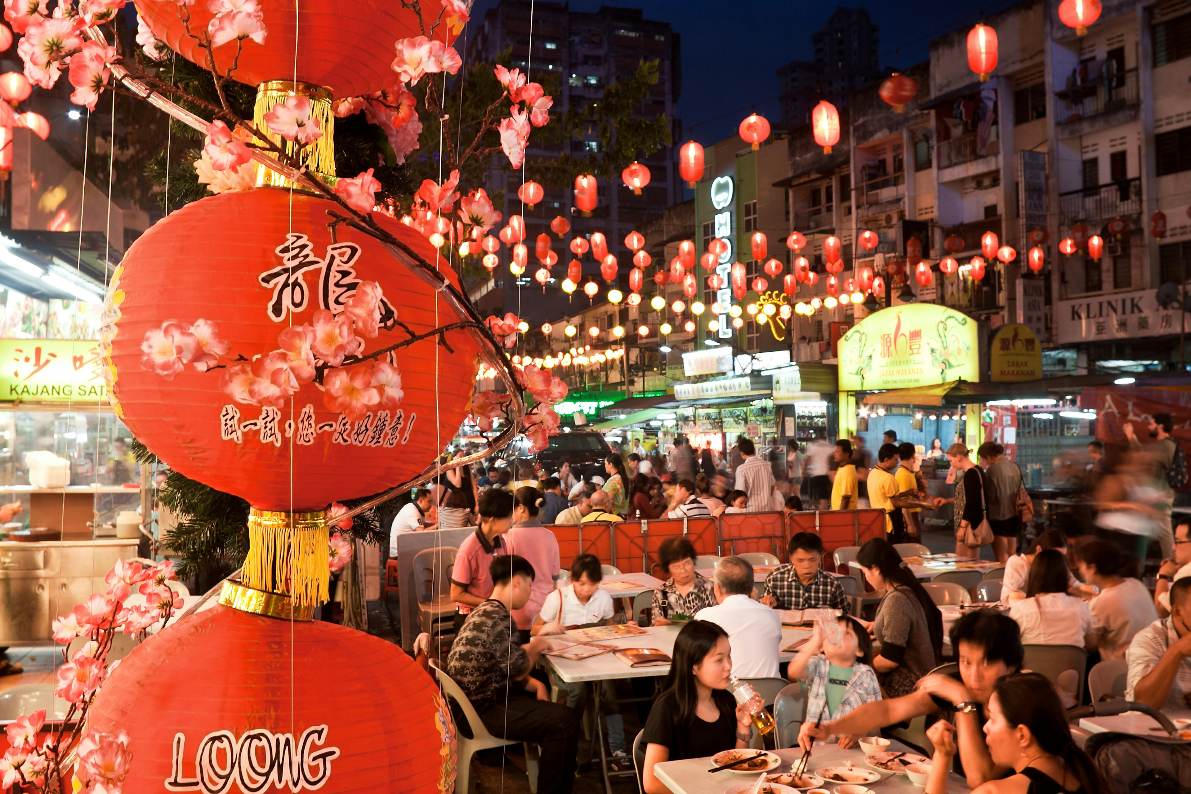 People eating at the Jalan Alor night market in Kuala Lumpur