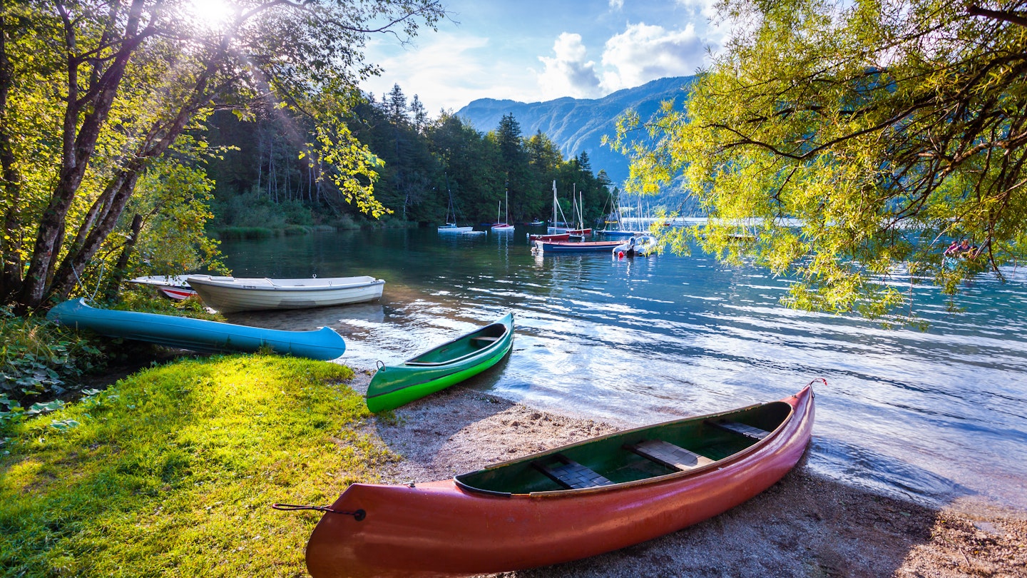 Bohinj Lake with boats, Triglav National Park, Julian Alps, Slovenia.