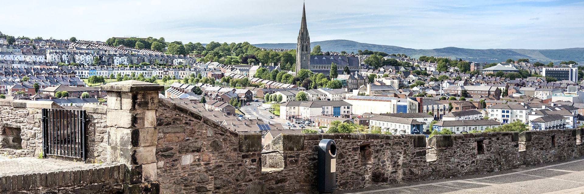 June 23, 2015: The skyline of Derry with St. Eugene's Cathedral near Free Derry Corner and the city wall.