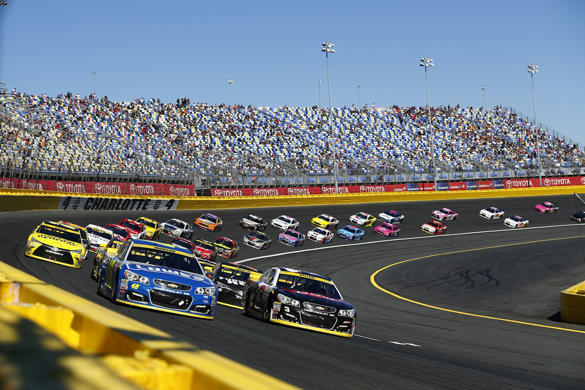 Jimmie Johnson (48) and Austin Dillon (3) lead the field to a restart during the Bank of America 500 at the Charlotte Motor Speedway in Concord.