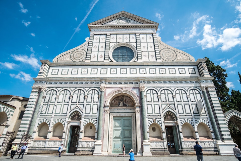 Florence, Italy. 18 May 2017 : Tourists walking around Piazza di Santa Maria Novella, plaza with a church in Florence, Italy.