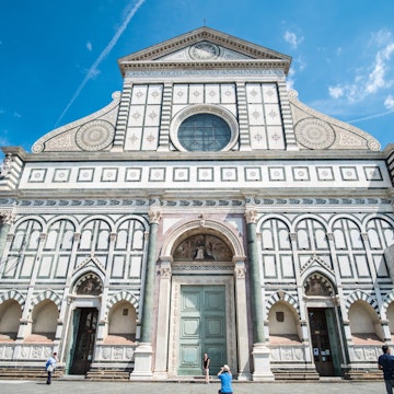 Florence, Italy. 18 May 2017 : Tourists walking around Piazza di Santa Maria Novella, plaza with a church in Florence, Italy.