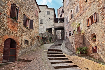 Anghiari, Arezzo, Tuscany, Italy: picturesque old narrow alley with staircase in the medieval village