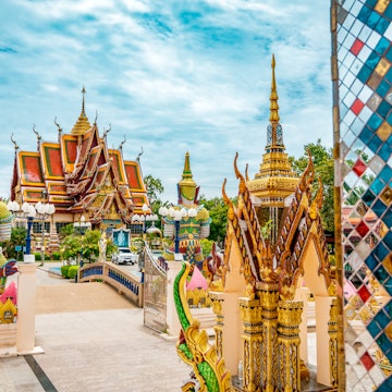 Wat Plai Laem Buddhism Temple statues during a sunny day in Koh Samui.