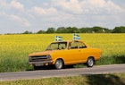 MOTALA, SWEDEN- 6 JUNE 2021:.Someone who is out driving through the Östergötland landscape and pimped his car with Sweden flags during the Swedish National Day. Photo Jeppe Gustafsson; Shutterstock ID 1986406079; your: Brian Healy; gl: 65050; netsuite: Lonely Planet Editorial; full: Things to know before traveling to Sweden