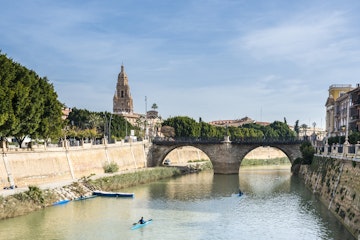 Embankment of Segura river and old bridge "Viejo de los Peligros". Murcia, Spain; Shutterstock ID 563709517; your: Barbara Di Castro; gl: 65050; netsuite: Online Editorial; full: Destination Update