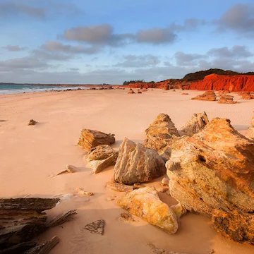 Reddell Beach Broome Australia
Sunset against the red pindan cliffs and sandstone rocks adds a dramatic contrast to this area.