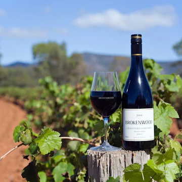A8NMXG Wine country - Hunter Valley, New South Wales, AUSTRALIA.
A bottle of Brokenwood Graveyard Shiraz amidst the Graveyard Vineyard in the Hunter Valley. The region is renowned for its Shiraz and Semillon wines
Image shot 2007. Exact date unknown.