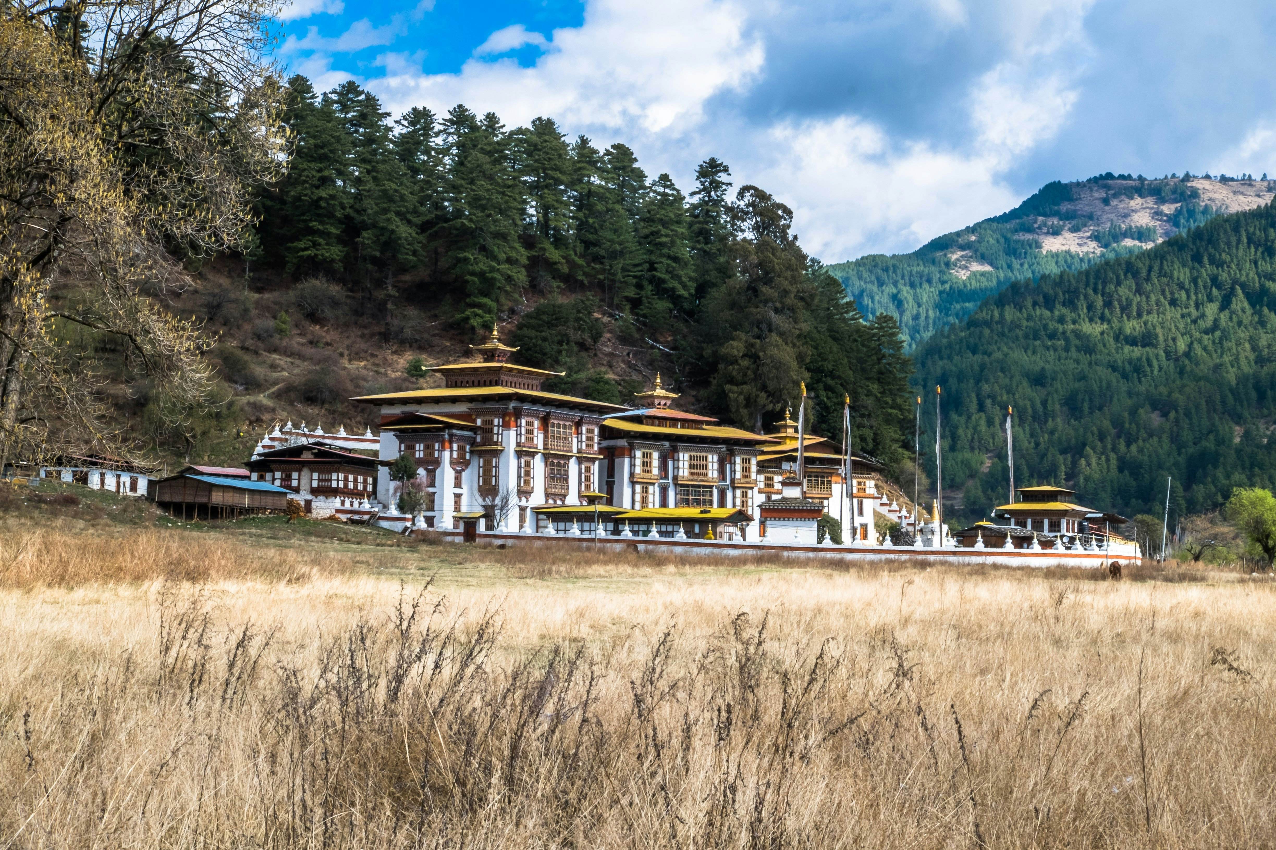Kurjey Lhakhang means "Body Imprint Temple" is located in Bumthang, central Bhutan. It was built in the 8th century. Guru Rinpoche, the tantric master of Bhutan Buddhism, meditated in this temple for three months and left his body imprint inside the cave. "Kurjey" means body imprint. At the side of the temple there is a tall cypress tree that is believed to have sprouted from the walking stick of Guru Rinpoche.